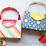 Click for the full tutorial for this tiny purse treat holder - the perfect packaging for lip balm, candy, jewelry, or other small treats!