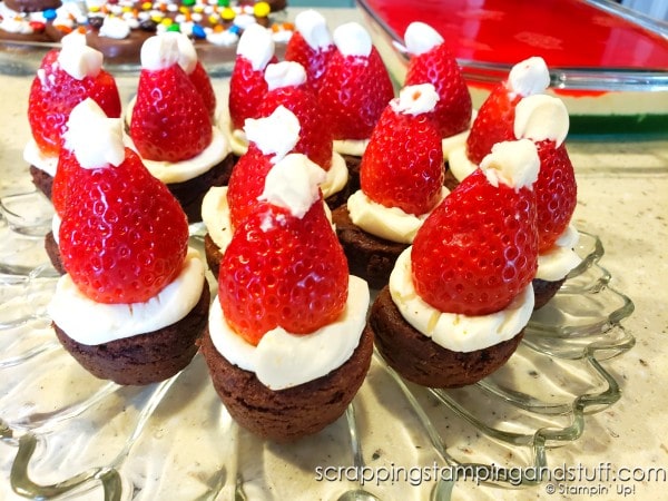 Take a look at our fun food Christmas celebration featuring snowman pizza, Christmas tree bread, a wreath relish tray, santa hat brownies, penguin oreos and Grinch punch!