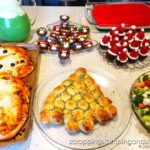 Take a look at our fun food Christmas celebration featuring snowman pizza, Christmas tree bread, a wreath relish tray, santa hat brownies, penguin oreos and Grinch punch!