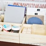 Click to see 12 ways to use a dollar tree crate for craft room organization! Organize your adhesives, embellishments, ink pads and more using a $1 wood crate!